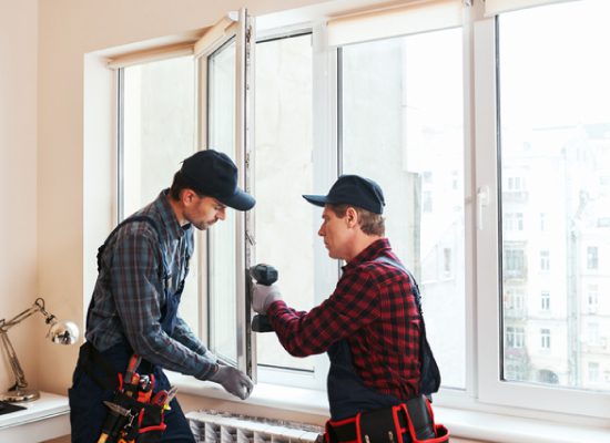 housing construction defects men fixing windows